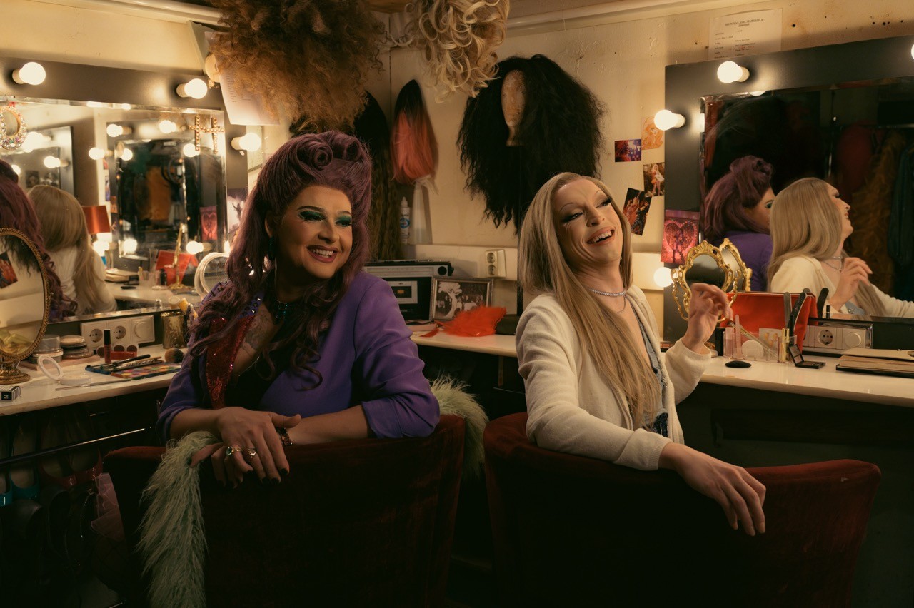 two drags smiling