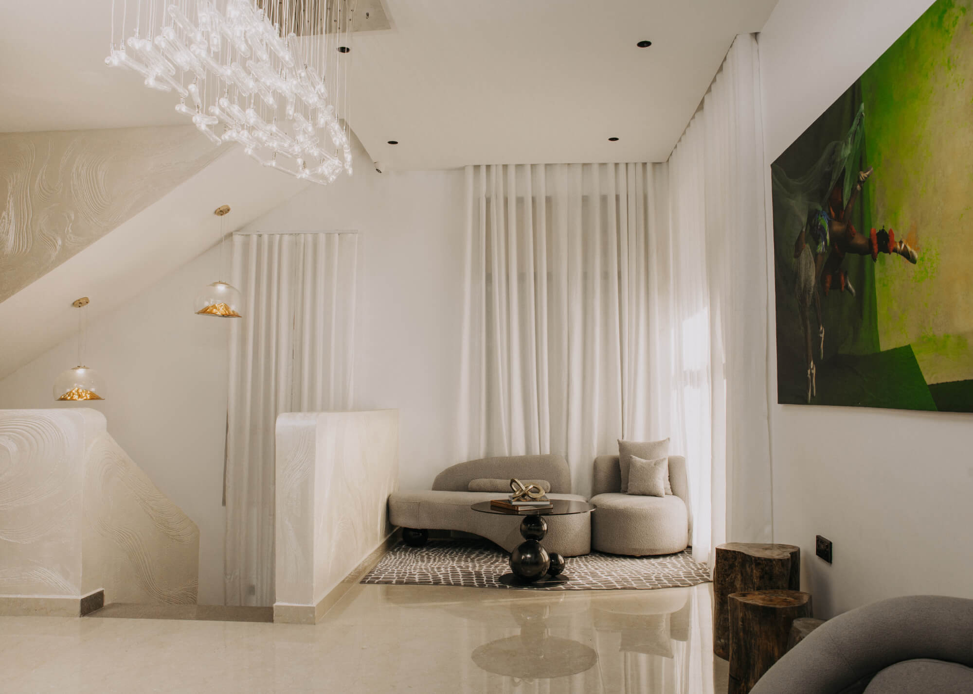 a living room with a tv and chairs