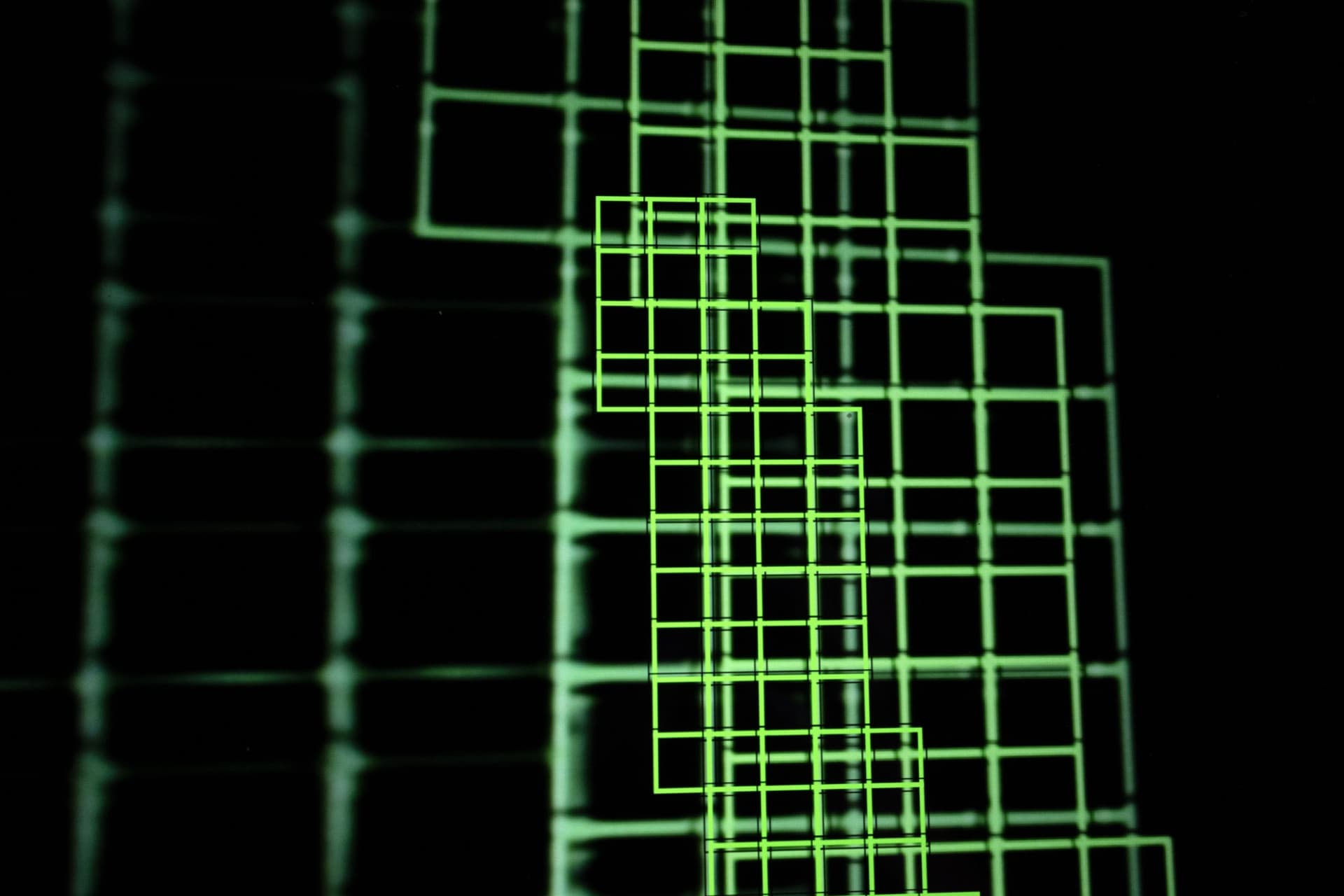 Layered green autofocus grid creating dense central cluster, overlapping detection boxes showing recursive computational vision with varied transparency