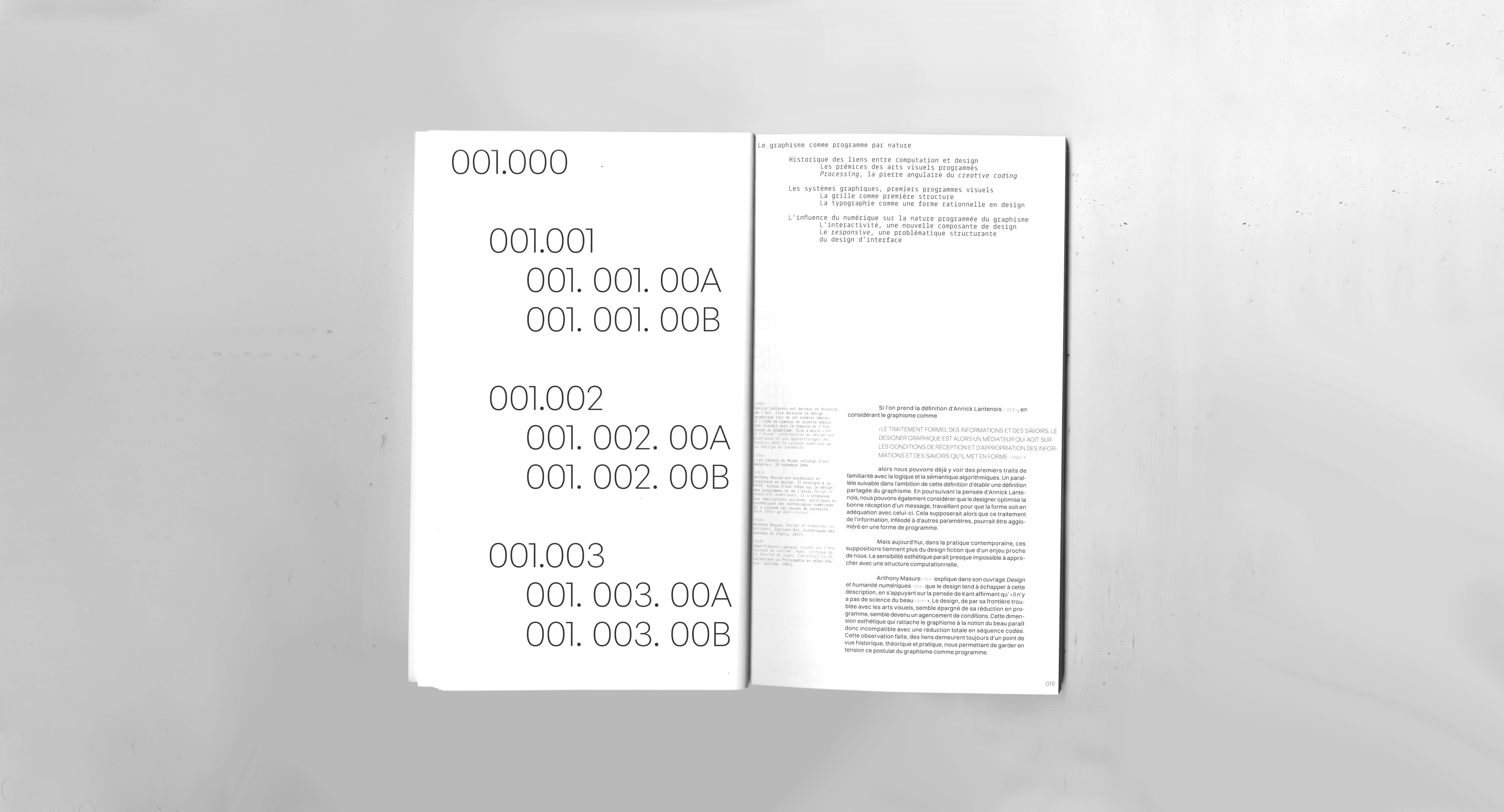 Minimalist editorial spread with systematic numbering layout in bold sans-serif typography on white pages