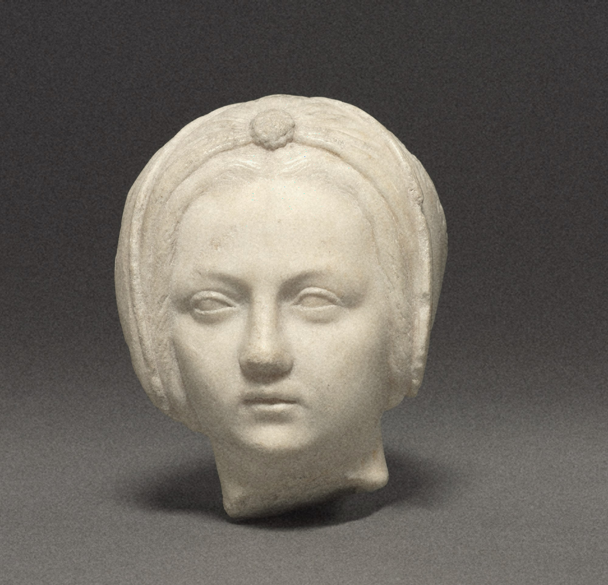 marble head of a young woman with a veil