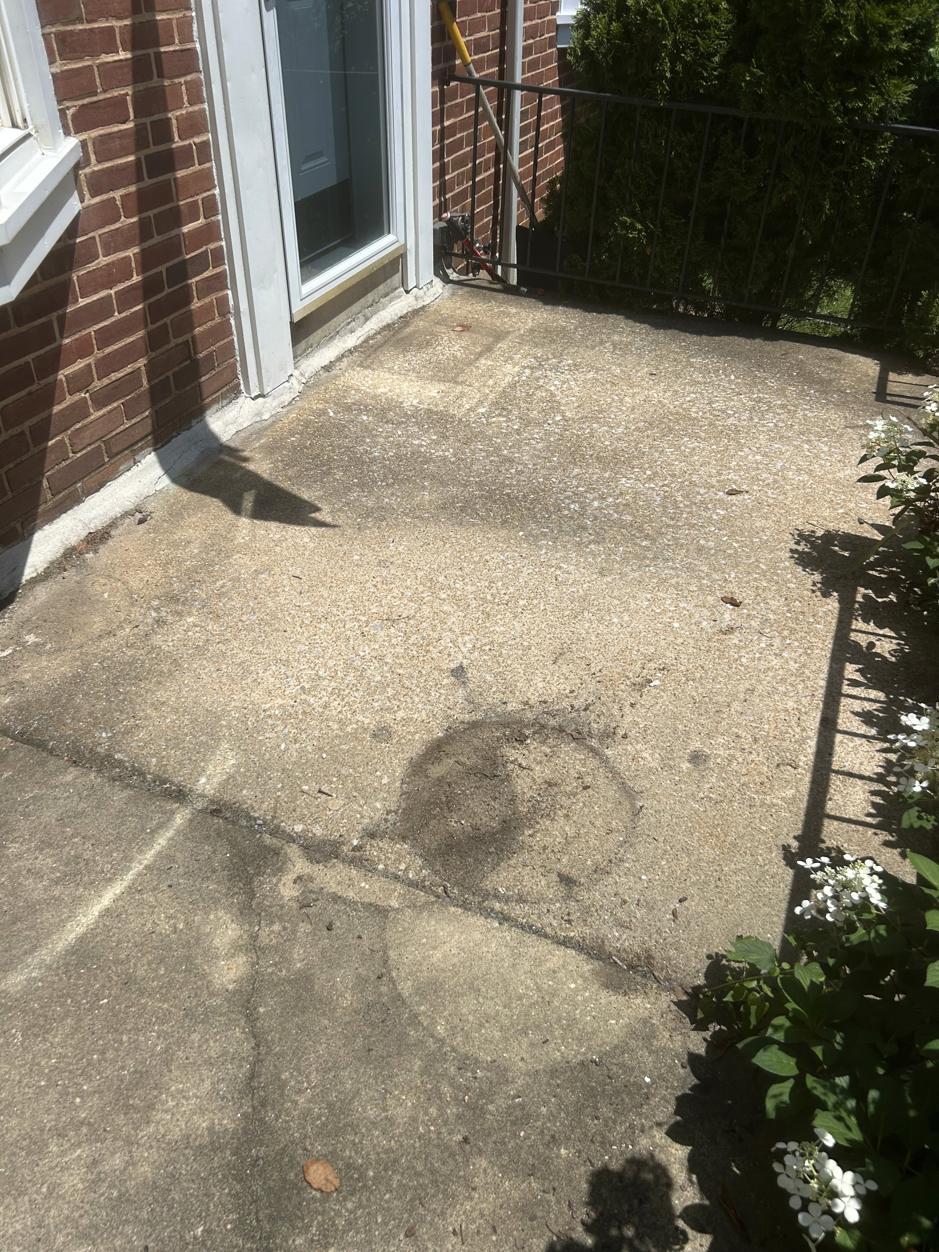 Dirty front concrete porch and landing before pressure washing in Rodgers Forge.
