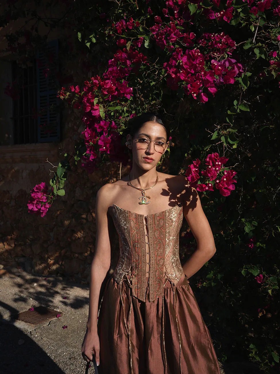 Raina is our one-of-a-kind four-panel corset, handcrafted in-house using a vintage silk saree. The structured silhouette features V-cut detailing at the front, along with lace-up panels on both the front and back,