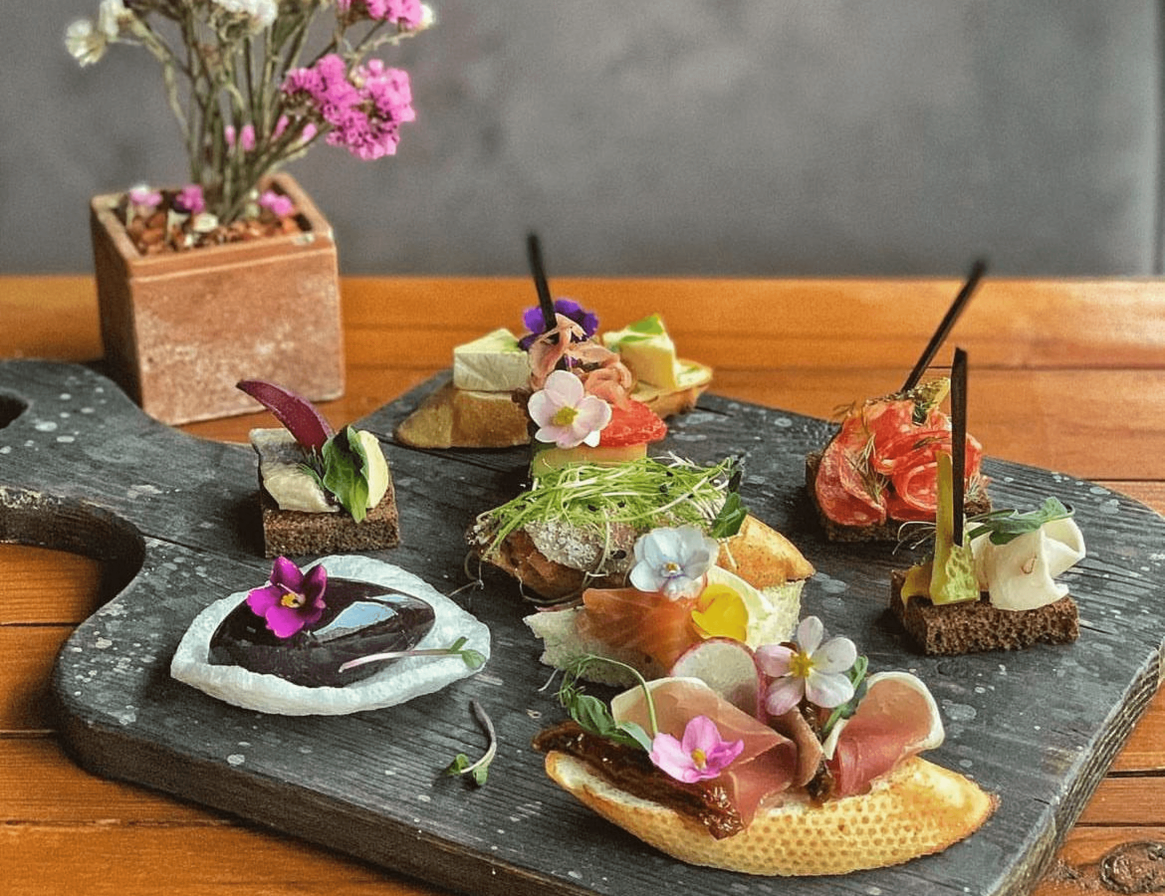 an interior of a fine dining restaurant with focused shot on the table with the plates and glass has been served