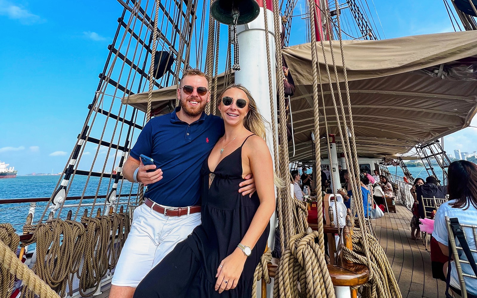 Happy couple dining on The Royal Albatross breakfast cruise in Singapore.