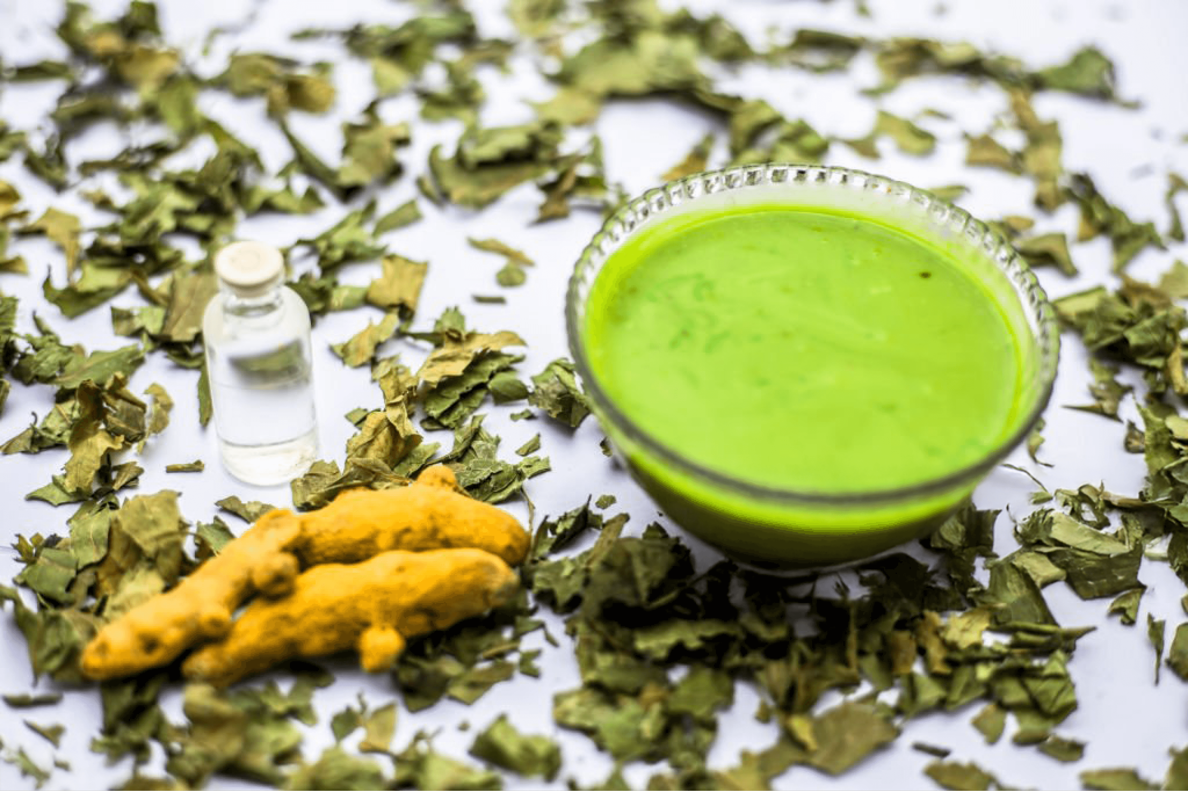 Herbal green face pack with turmeric and neem leaves for glowing skin