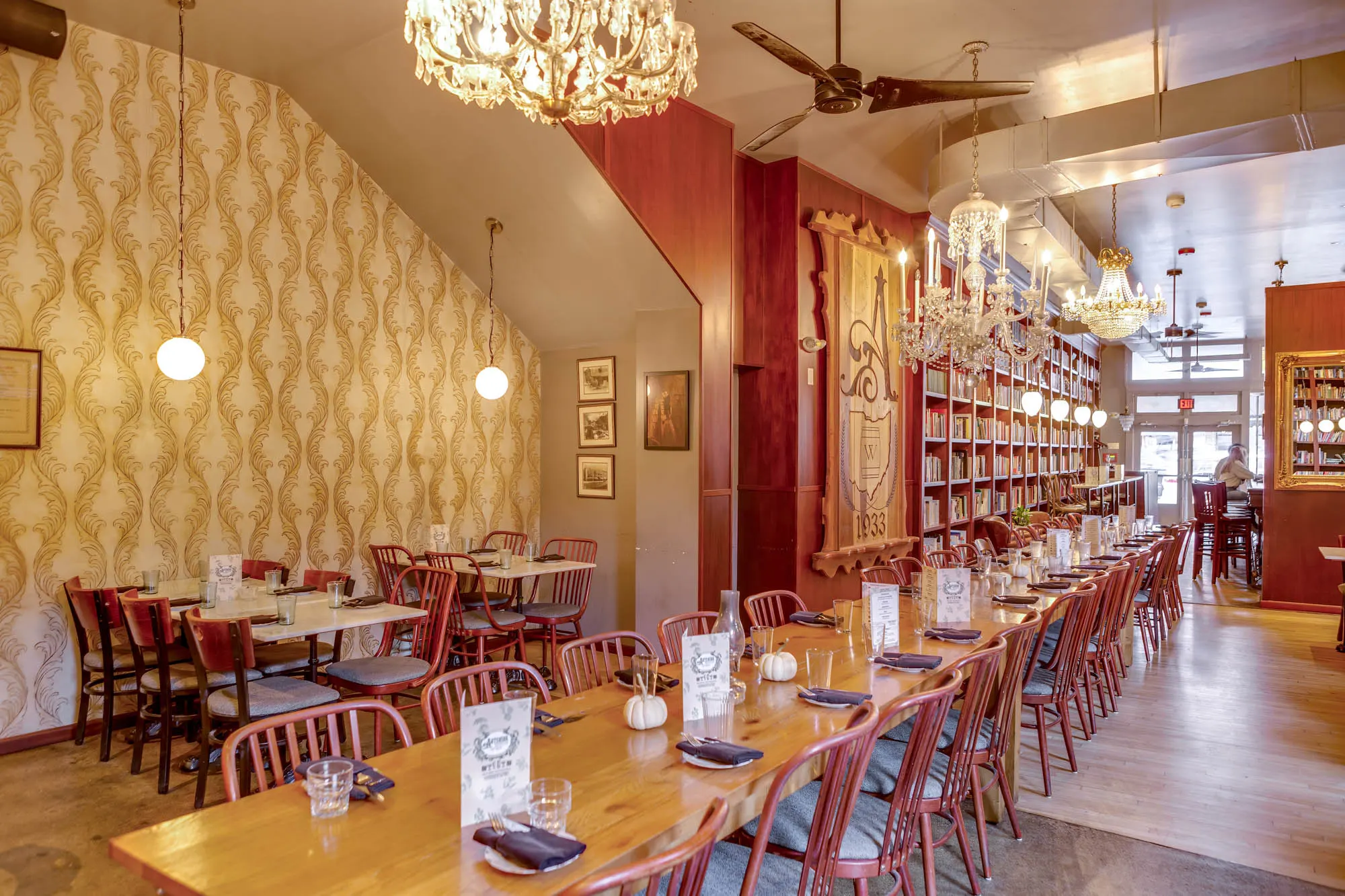 Long tables set for a party under chandeliers at Asterisk