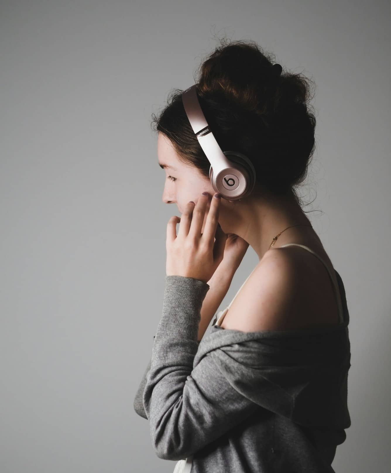 A woman listening with headphones