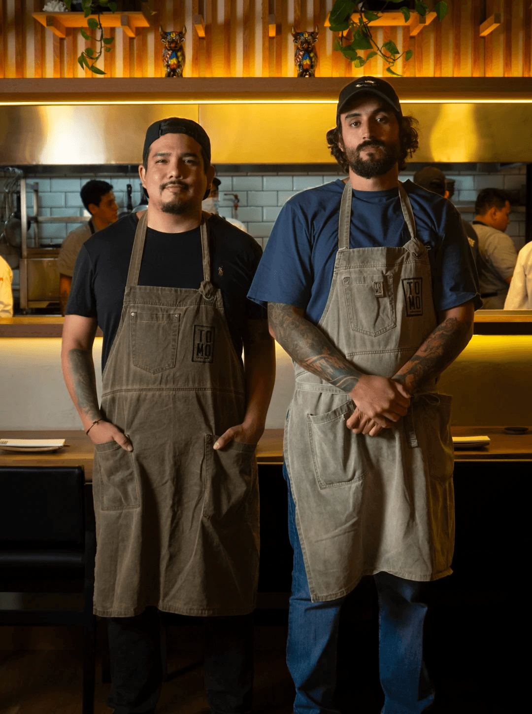 two women talking while holding drinking glasses