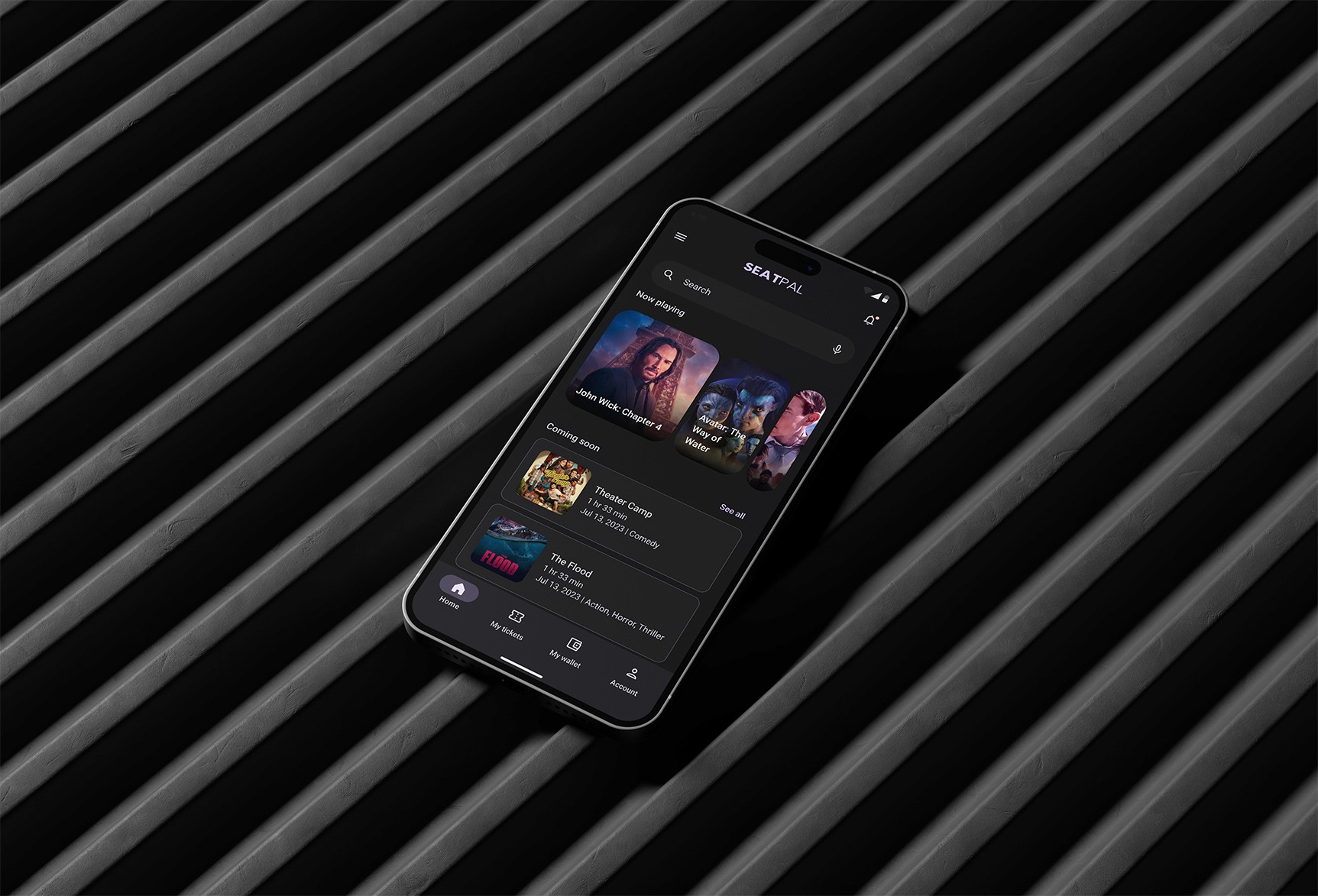 Smartphone displaying a digital card interface on a sleek white surface, surrounded by a modern workspace.