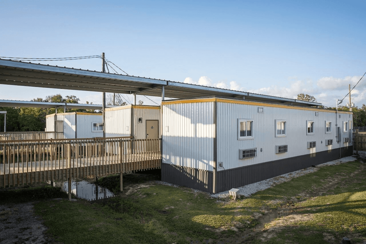 Temporary workforce housing unit with covered walkway at Moss Lake Village.