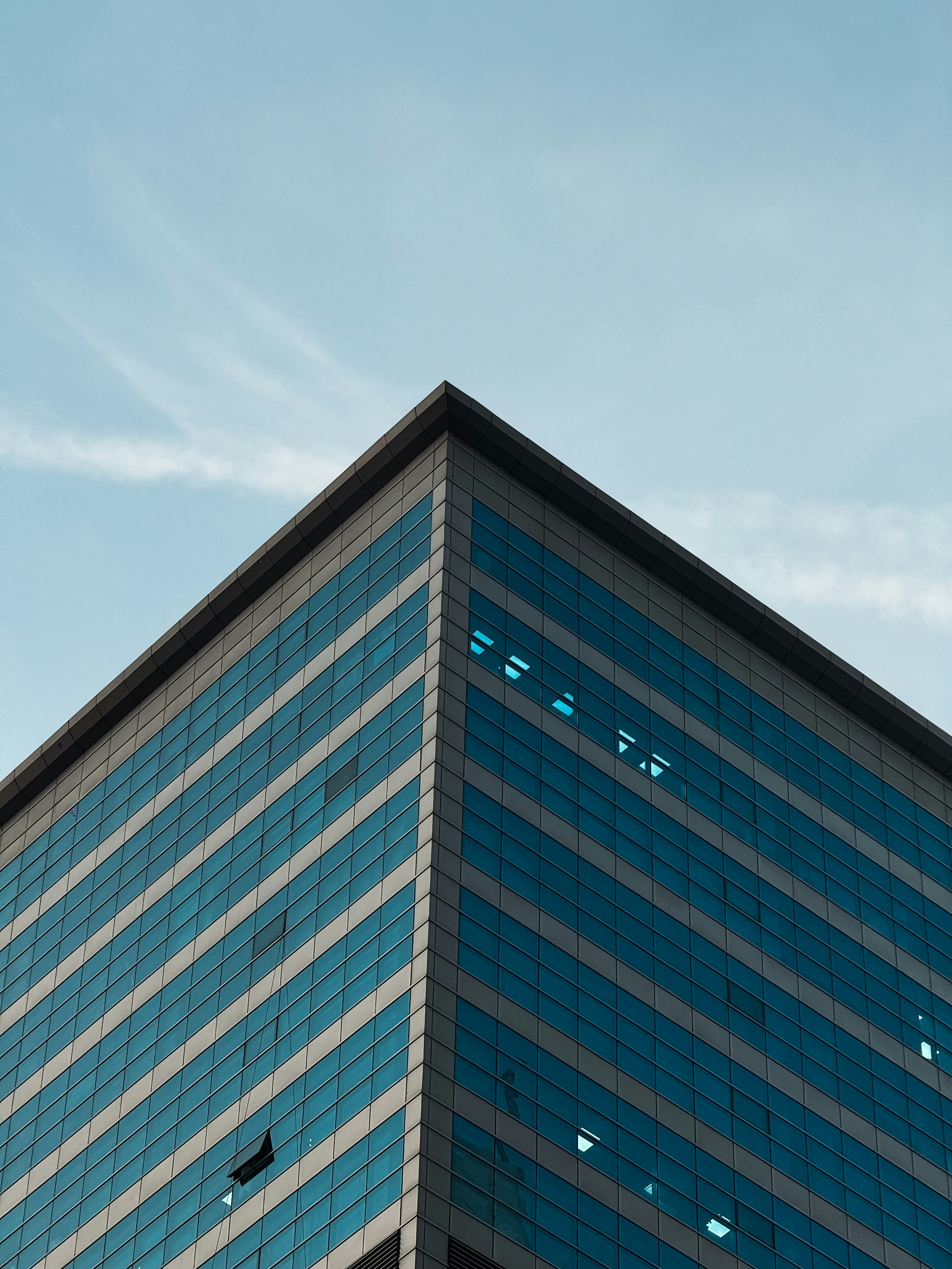 A tall building with a sky in the background