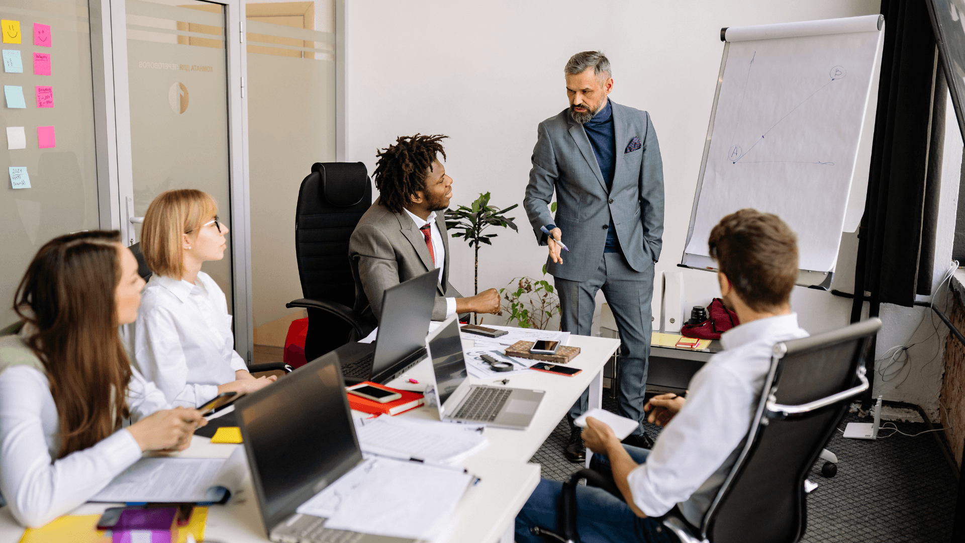 car parked with a building and trees in the background