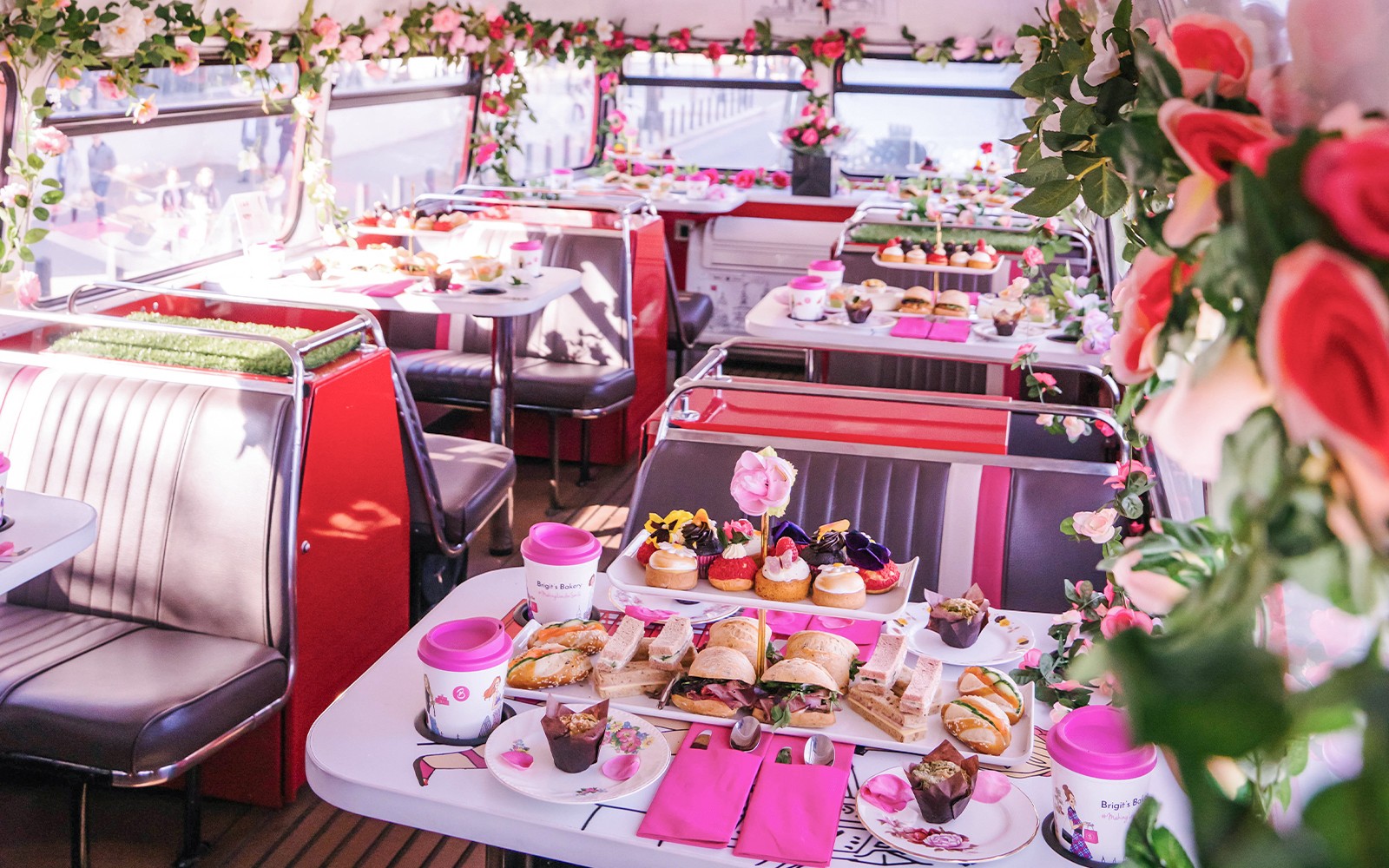 Afternoon tea setup with sandwiches and pastries on Brigit’s Bakery bus tour.