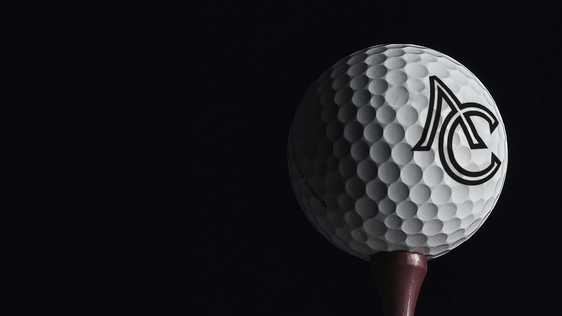 A white golf ball with a logo is prominently displayed against a dark background, sitting on a tee. The image conveys a sleek, professional tone.