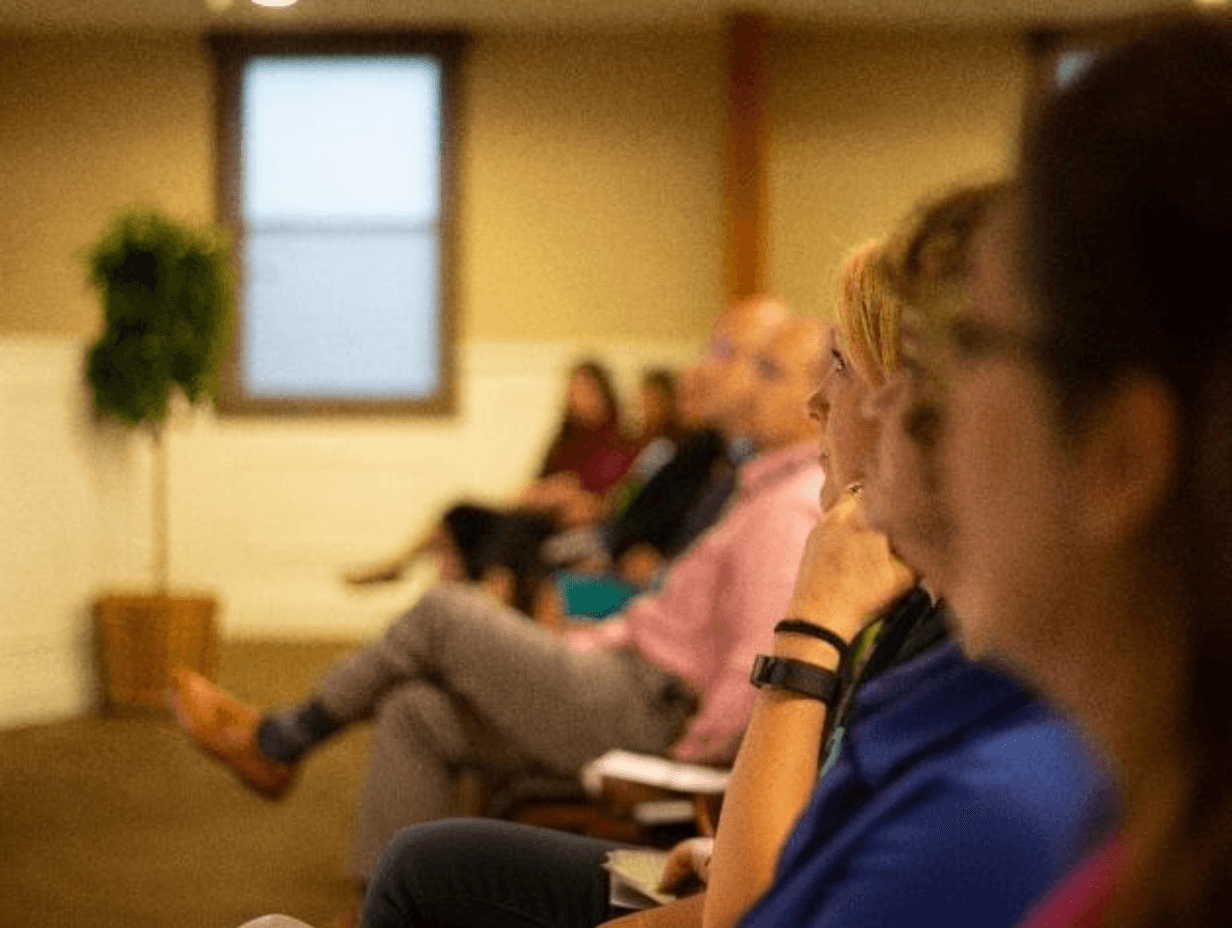 a group of people sitting in a room