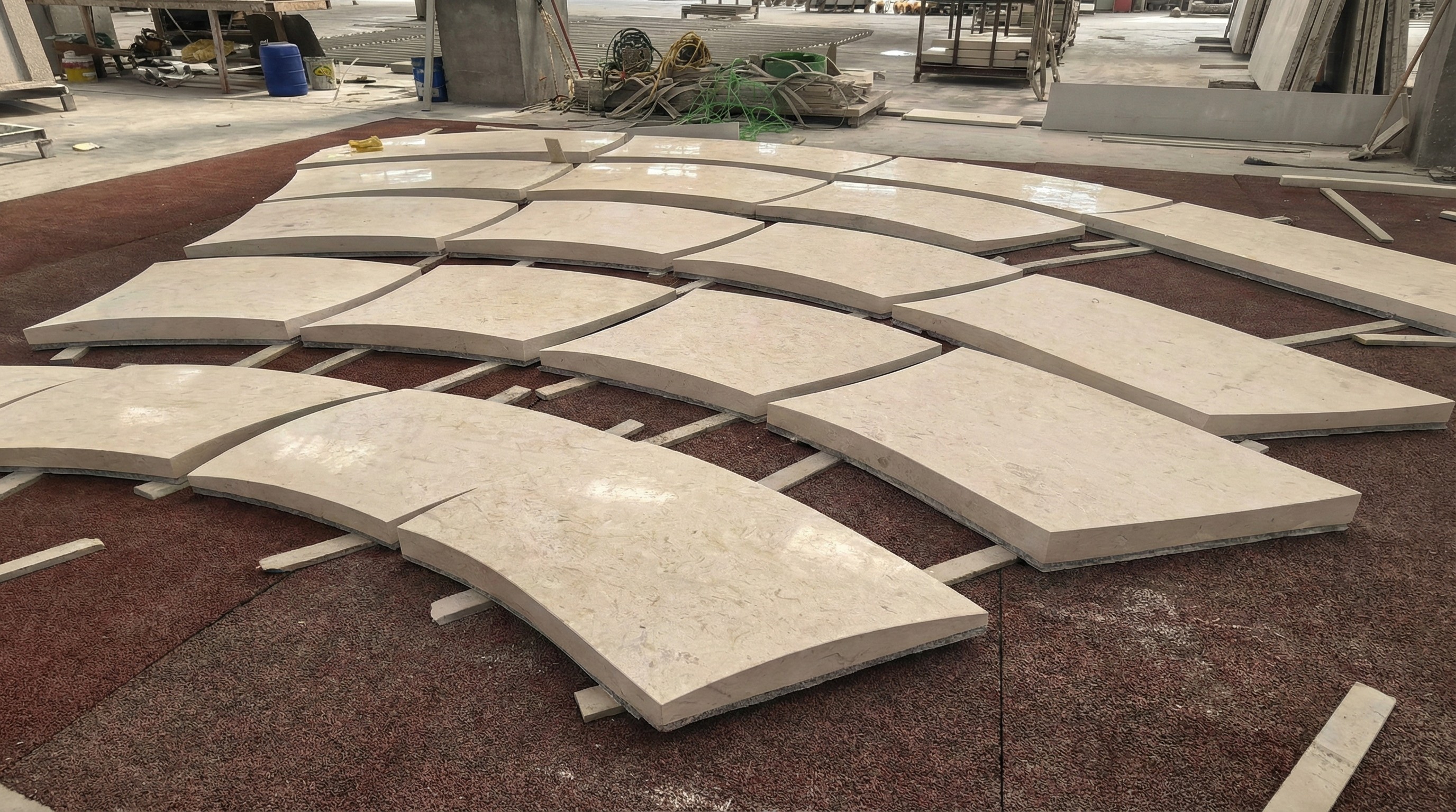 Precision-cut curved marble wall cladding panels prepared by NOVA STONE for a grand entrance project.