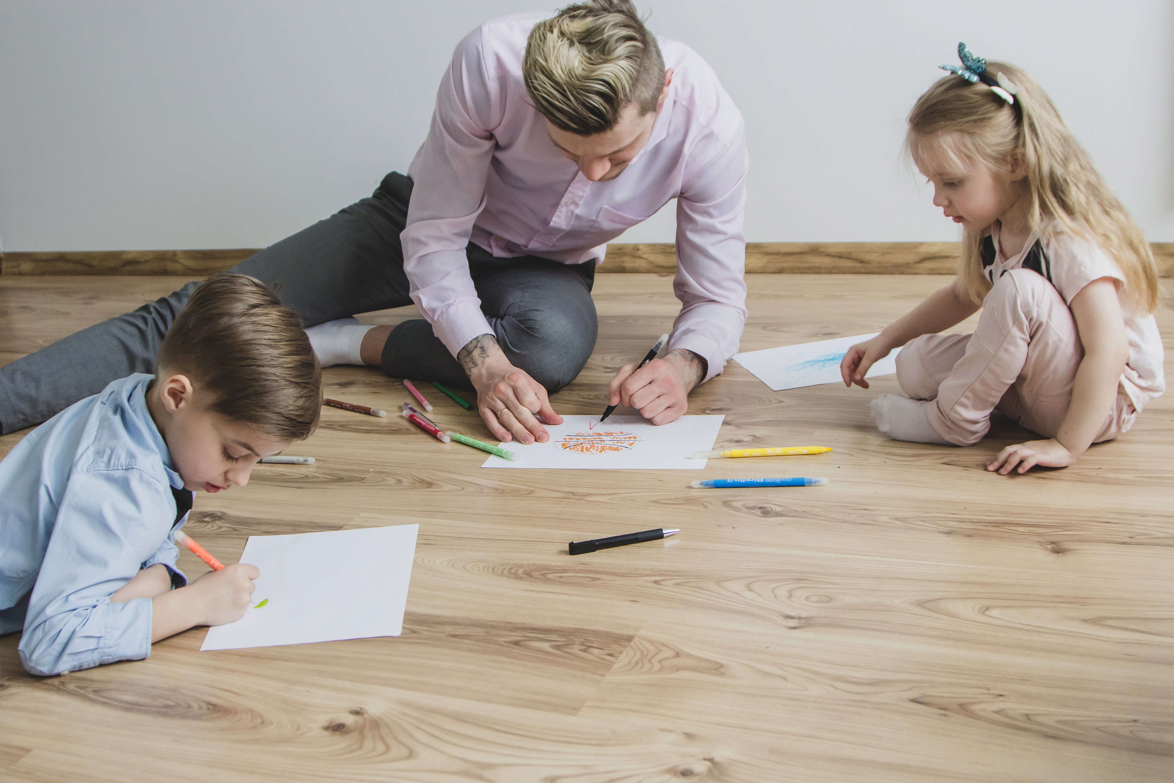 Family prepping for hybrid flooring in Brisbane—clear floor space and protect skirting for a smooth install and a durable, stain-resistant finish.