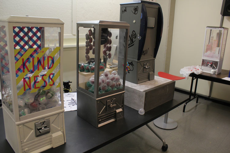 A photo of three rubber ball vending machines.