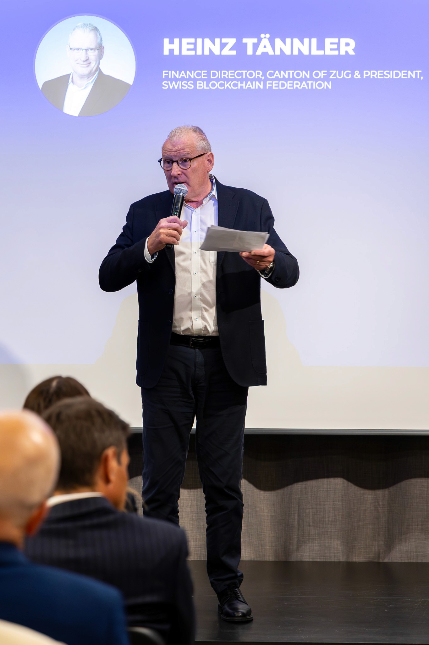 Heinz Tännler speaking on stage at CV Summit in Zug.