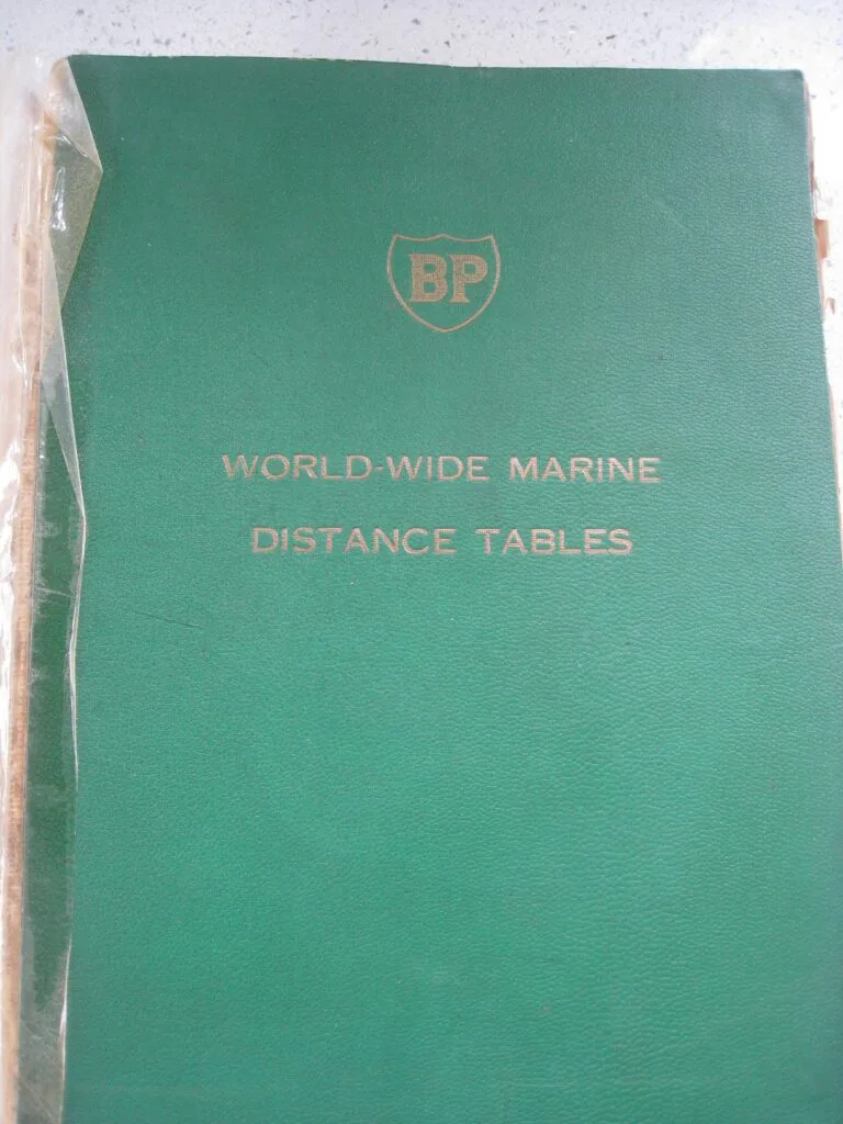 Dog-eared copy of the BP World-Wide Marine Distance Tables, a printed marine distance table volume