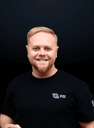 man standing beside wall