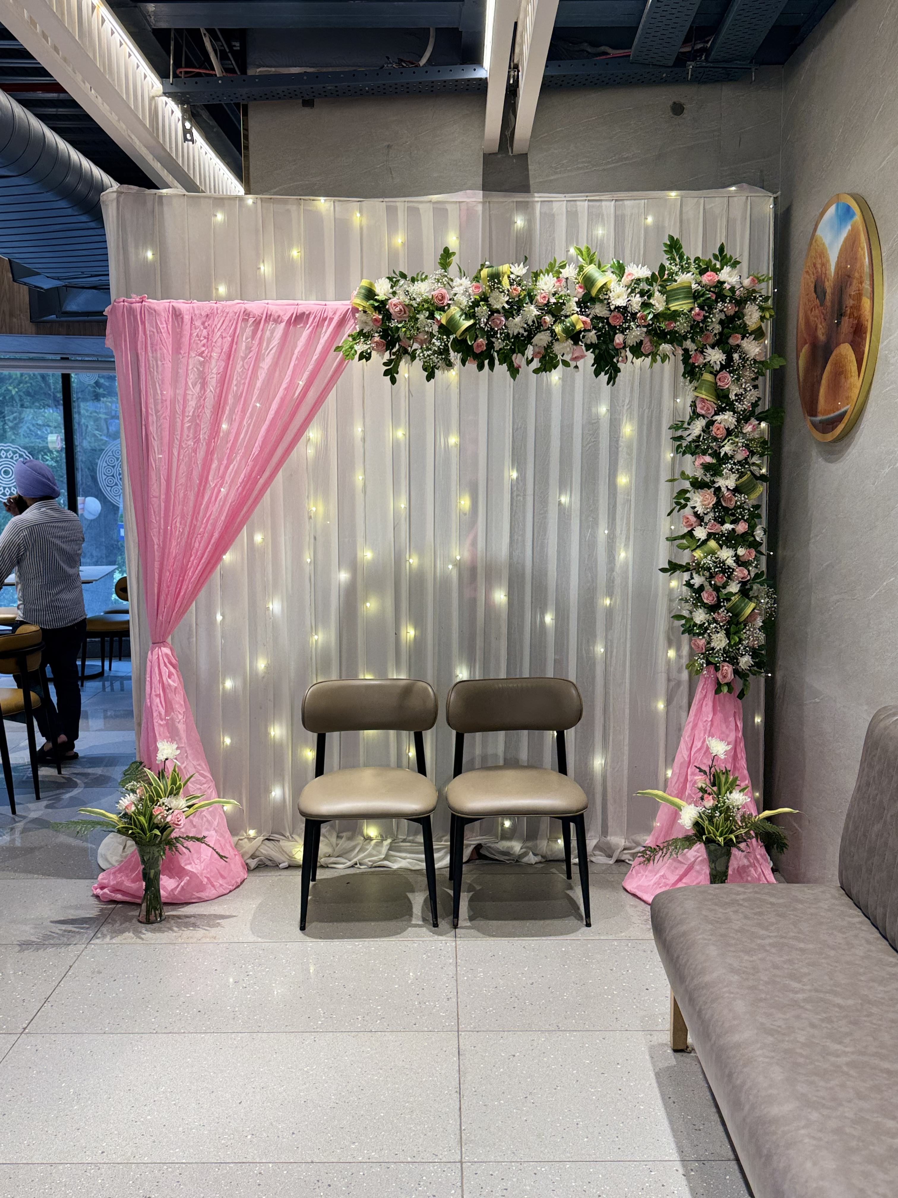 Beautiful Real flower engagement decor with pink drapes - perfect roka decoration by Decori in Dwarka, Saket & Malviya Nagar
