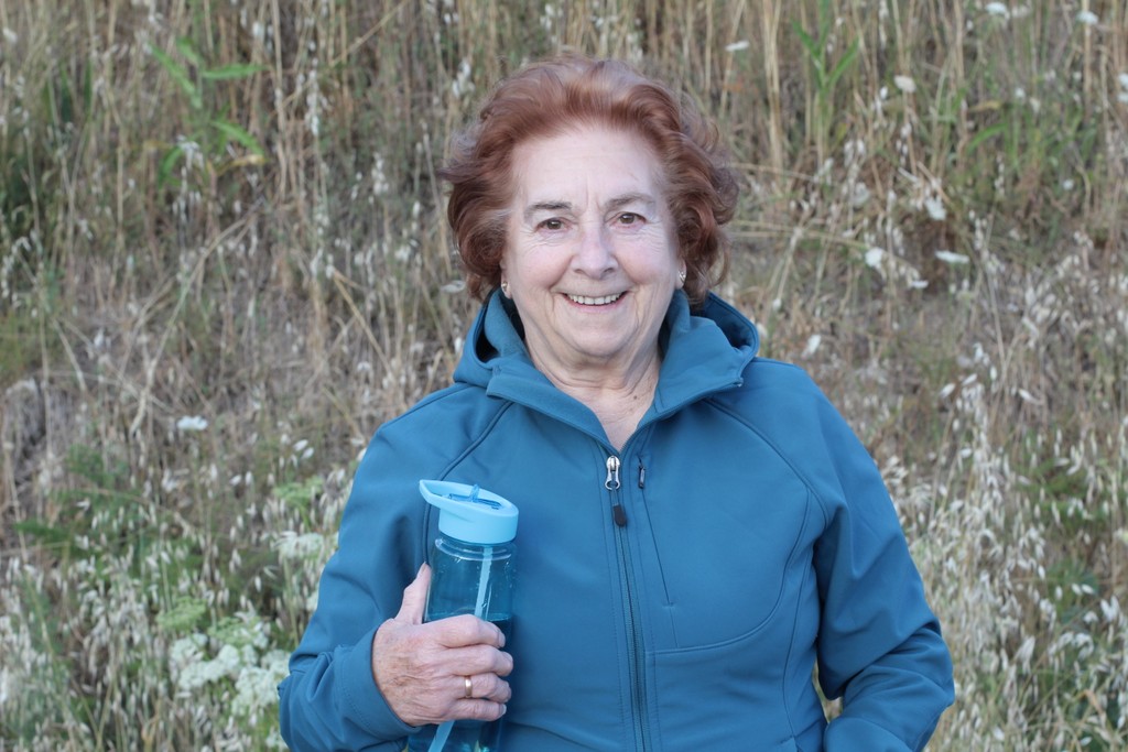 Senior woman outside with water bottle