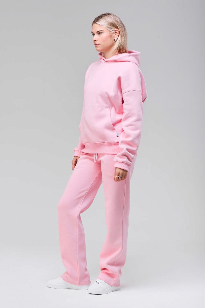Model wearing pink boxy hoodie, full figure