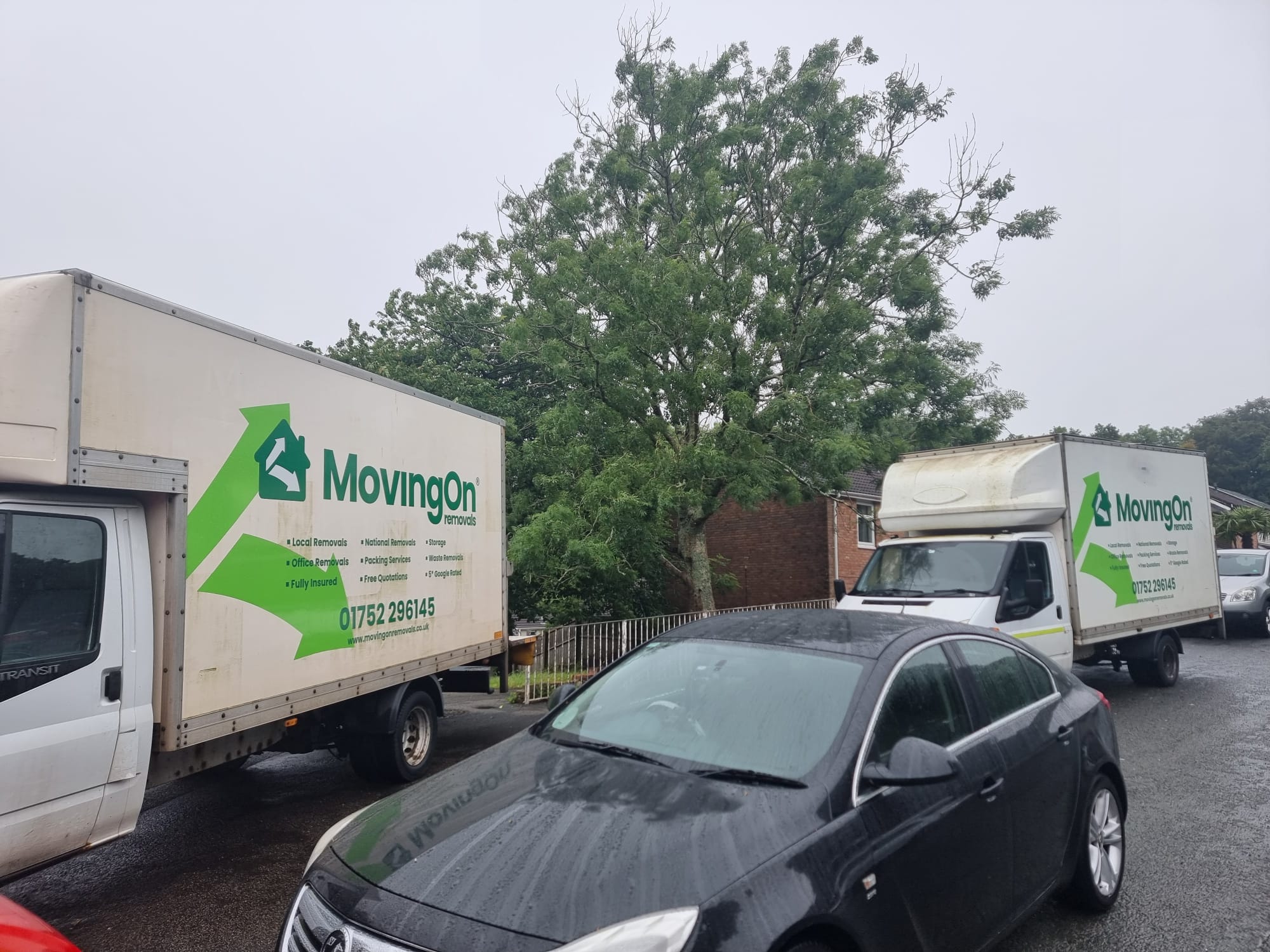 Moving On Removals team parking two vans on a narrow residential street during an Estover, Plymouth home move.