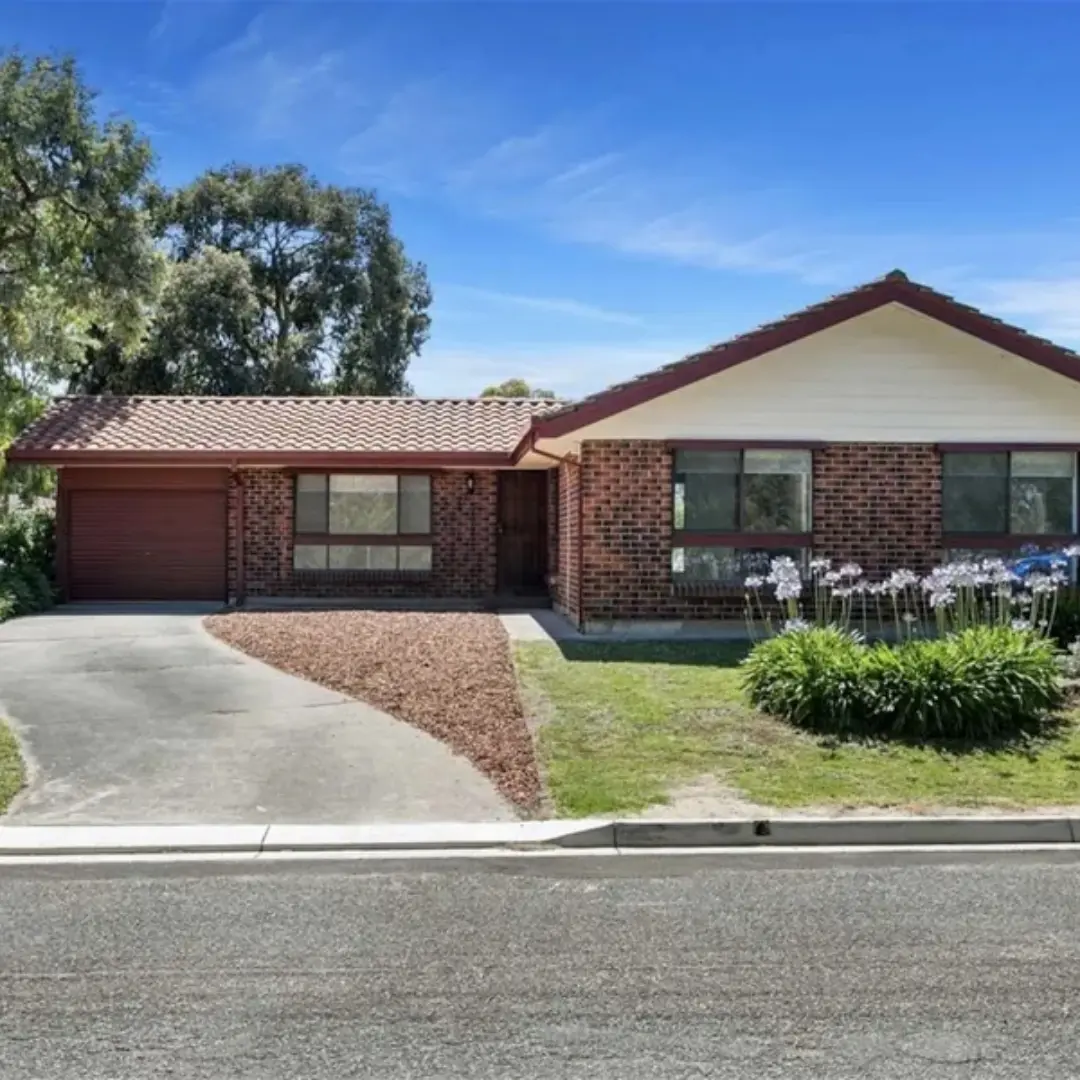 Brick ranch house with garage and garden