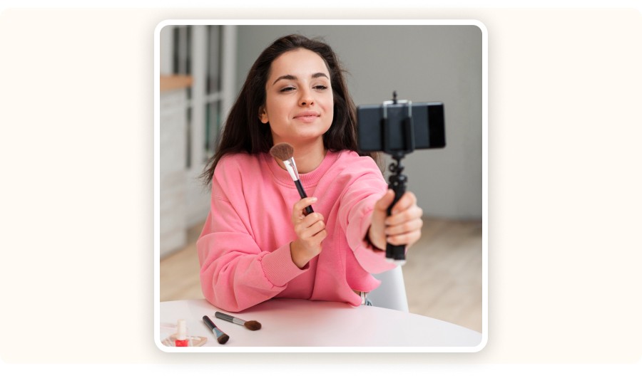 Young woman filming a makeup demo