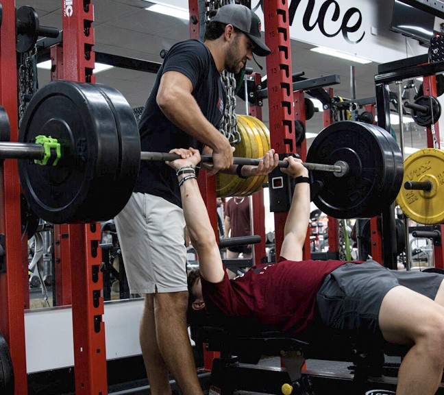 a group of people playing a game of ice hockey
