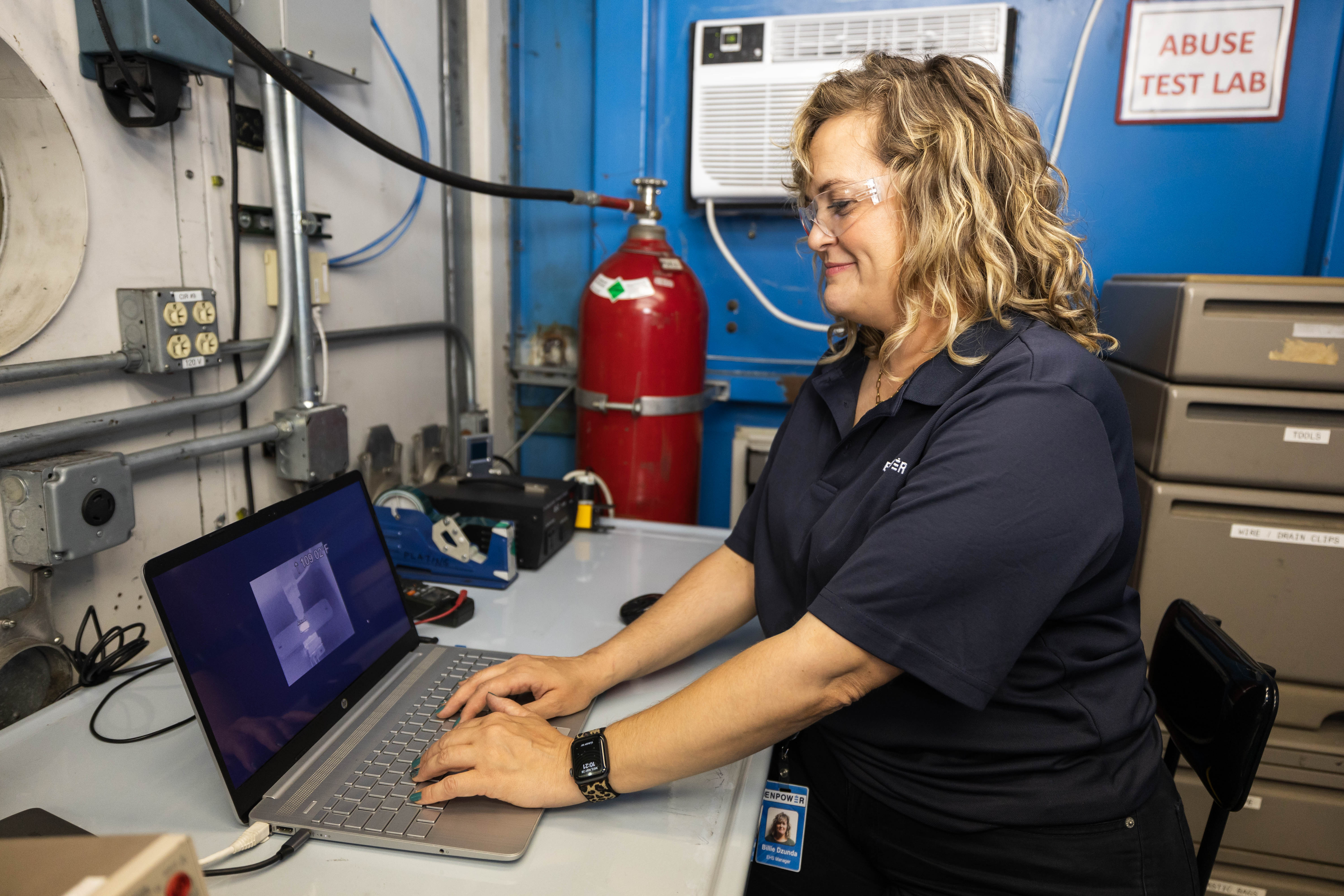 EnPower Engineer working on a laptop