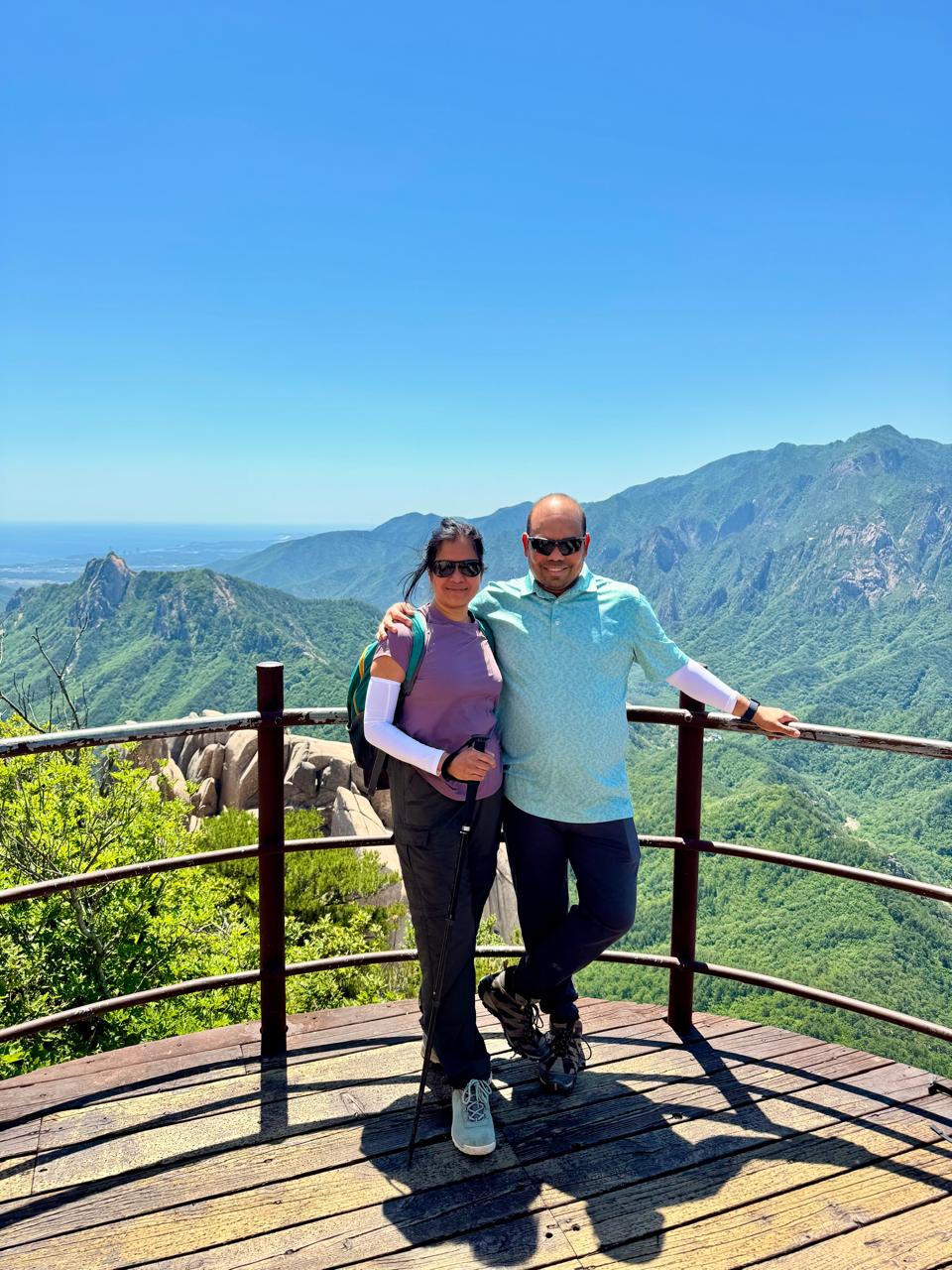 A picture of me and my husband at the eastern viewing deck of the Ulsanbawi summit.