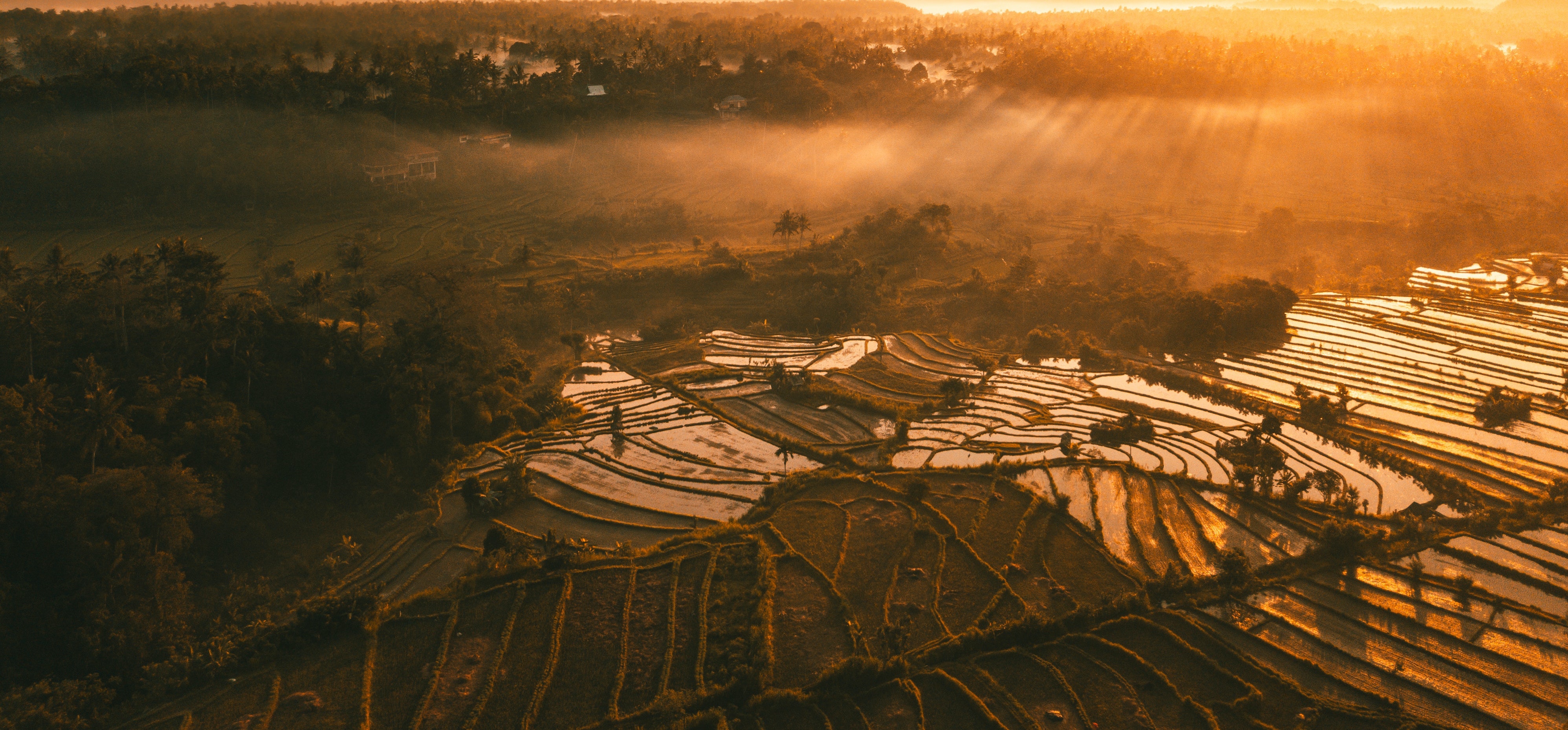 Silver glossy car on a industrial floor in a black room