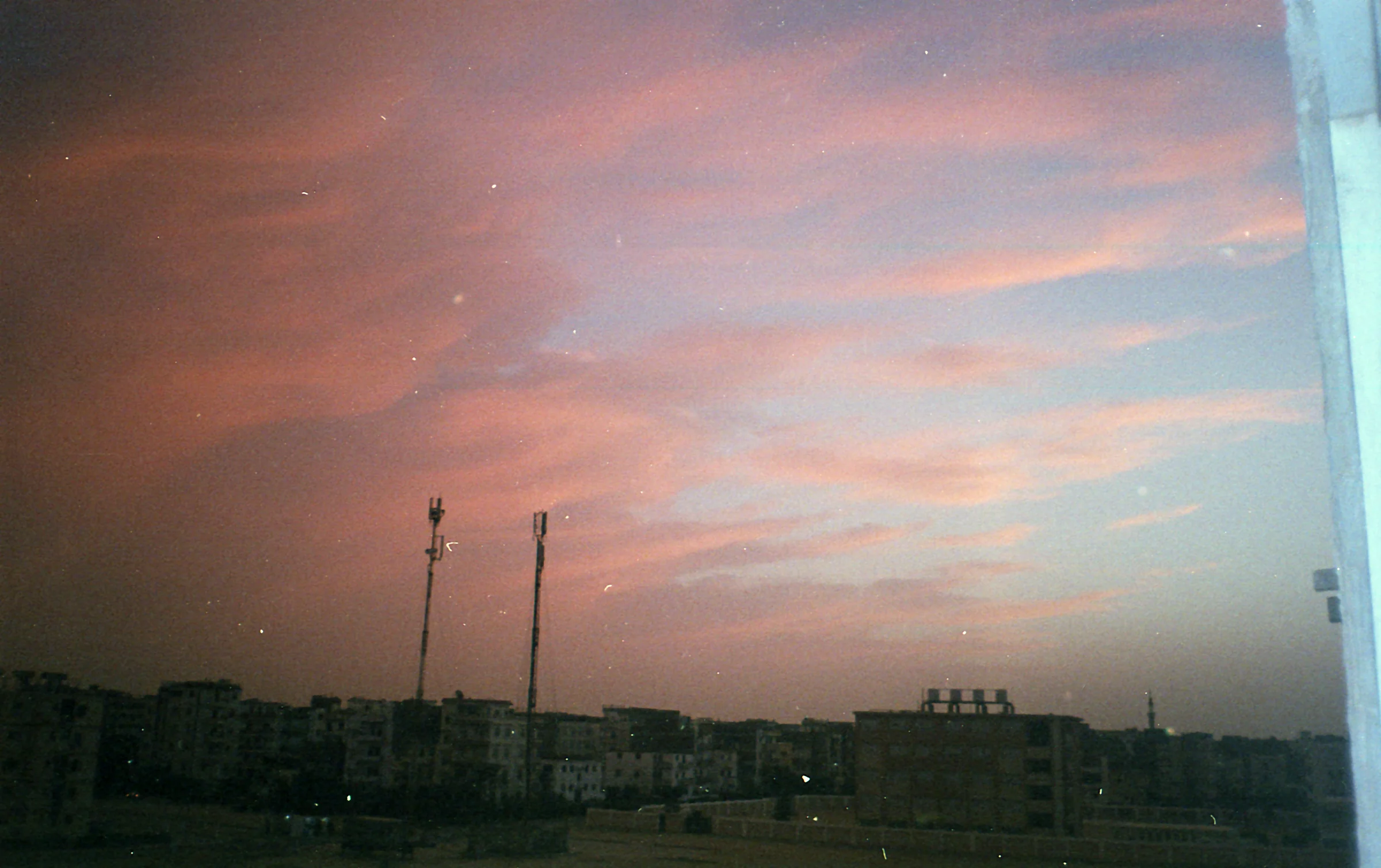 Pink Clouds Over Rooftops