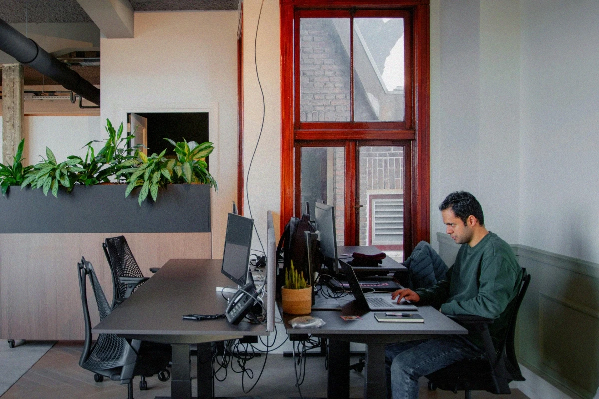 Man working in a well lit office