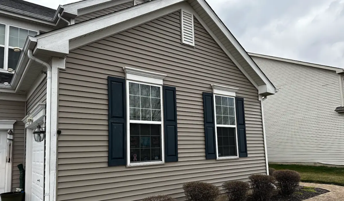 Freshly maintained vinyl siding prepared for winter siding maintenance in Warrenville IL suburb home exterior.