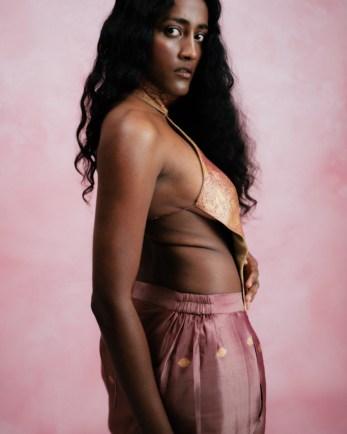 Apsara is our high-neck, backless top crafted from a brocade vintage silk saree, inhouse by skilled artisans. 