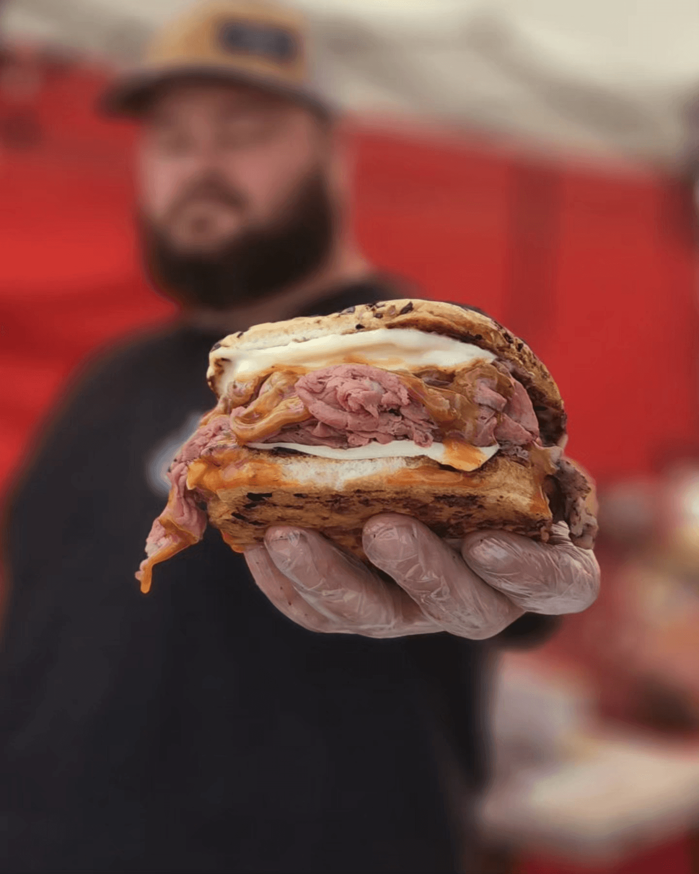 Big Jim holding one of his favorites and customer favorites underneath his vendor booth from the Farmers Market in San DIego
