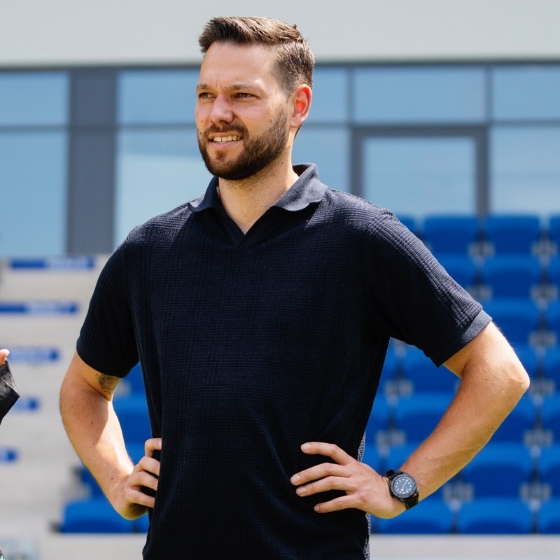 a man standing with black dress