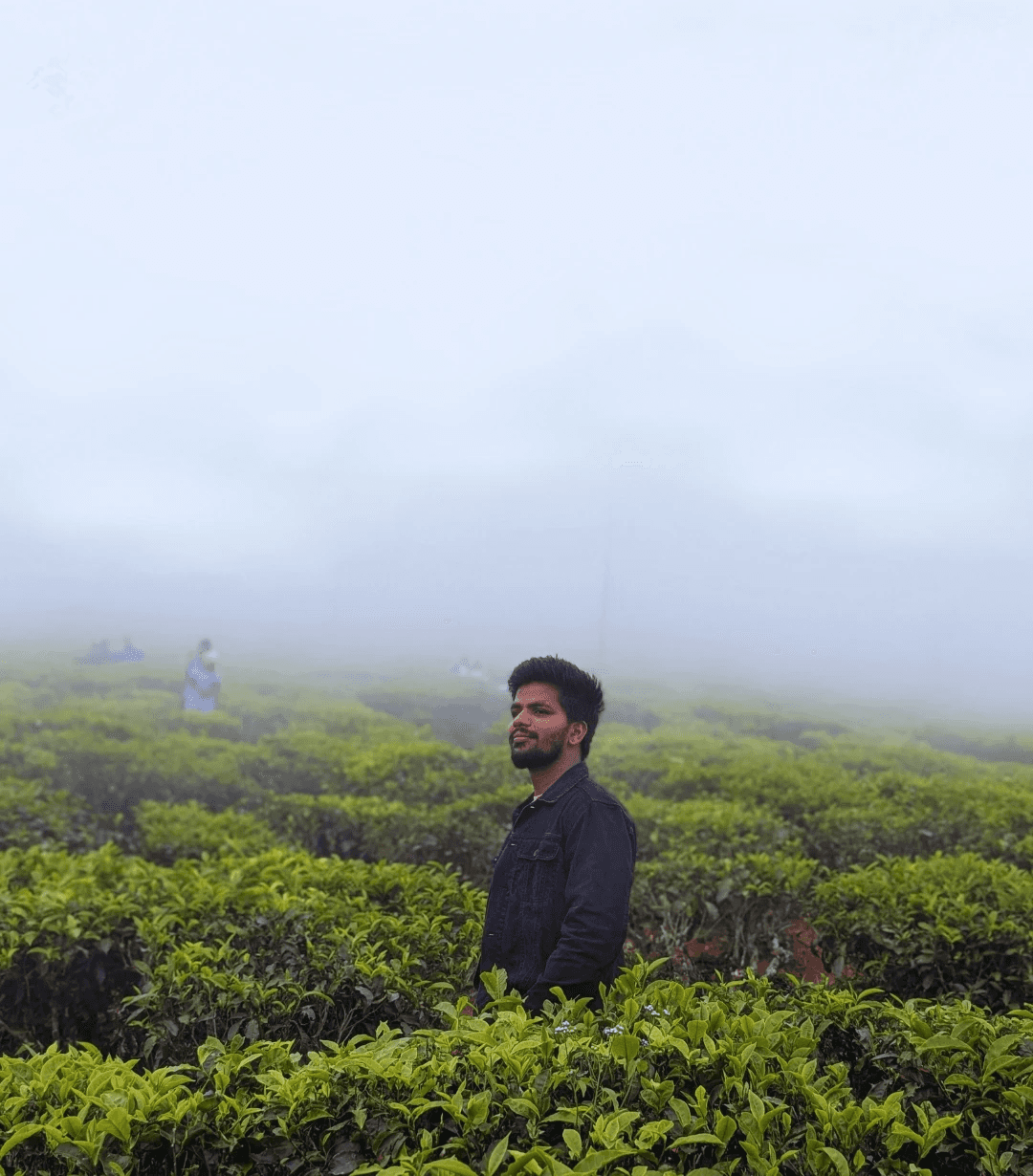Group of friends smiling on a lively city street at night