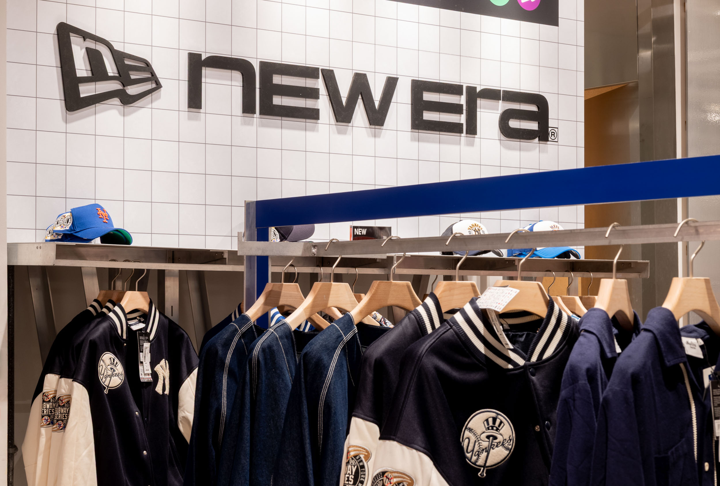 Sportswear retail environment with branded apparel displays, feature graphics and immersive pop-up activation design