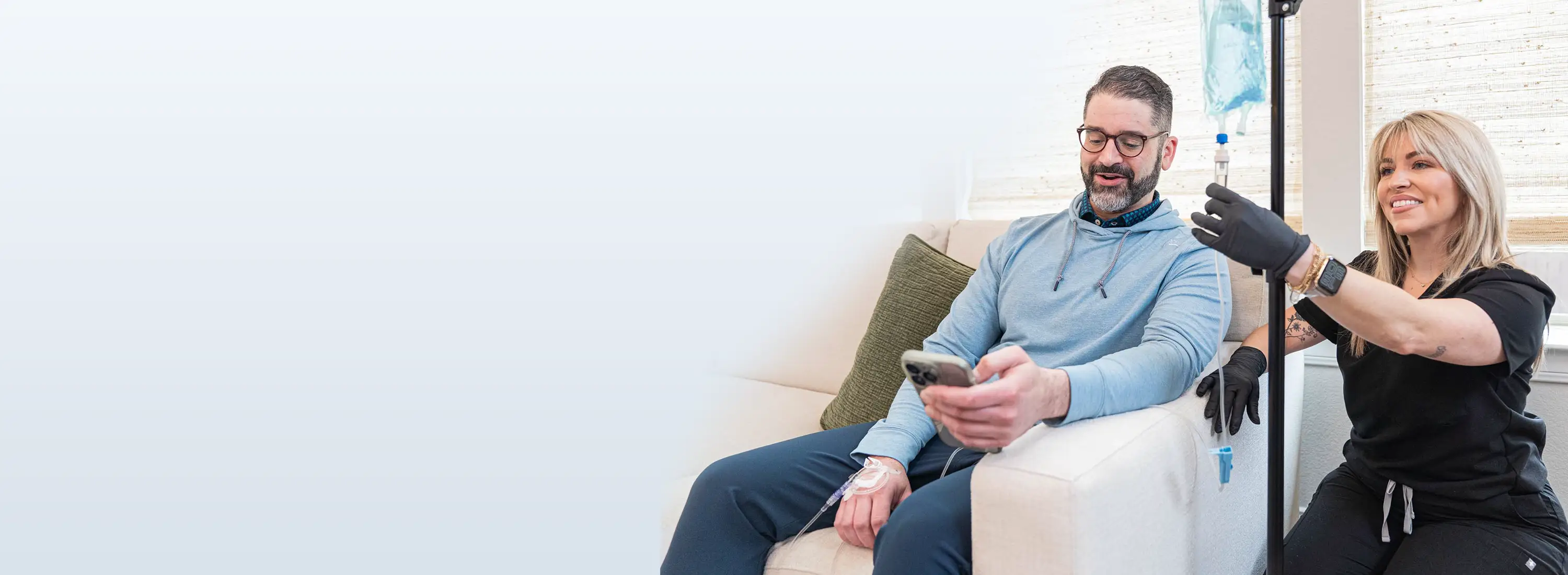 Man receiving IV for wellness support