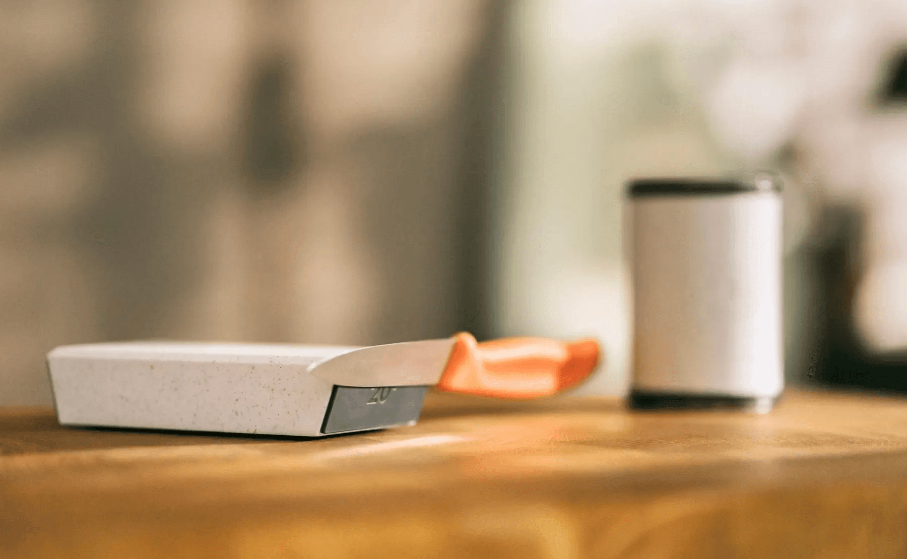 A small kitchen knife securely held by the HORL® Magnetic Angle Support, demonstrating the strength of the Grip Pad magnets in maintaining a stable position during sharpening.