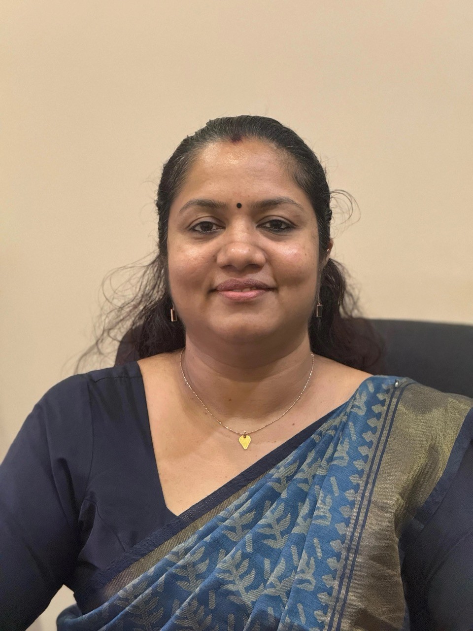 Dr. Chithra, Chief Physician and Medical Head at Au Revoir Resort, specializing in authentic Ayurvedic healing and wellness therapies