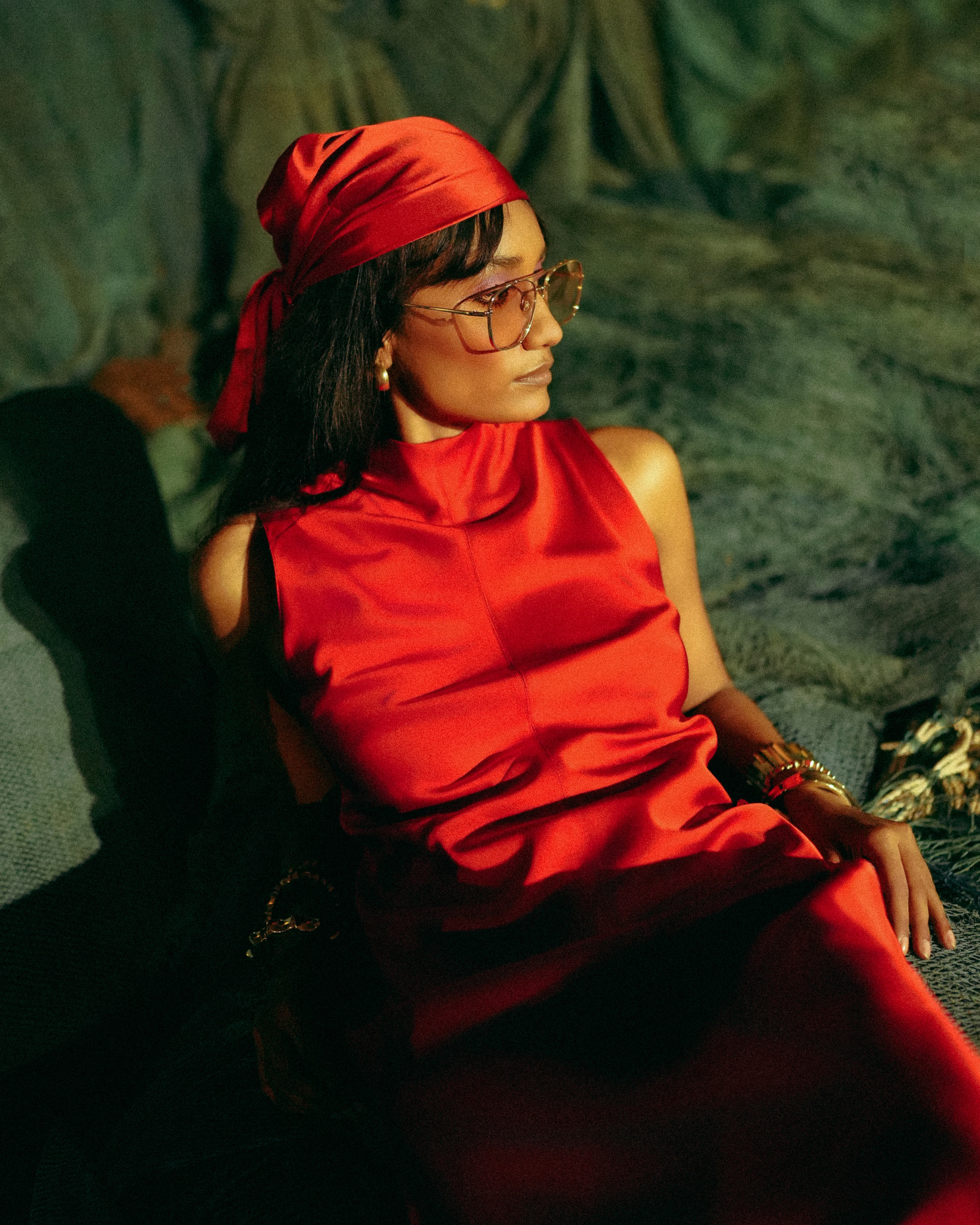 Astronaut seated in training chair wearing space suit