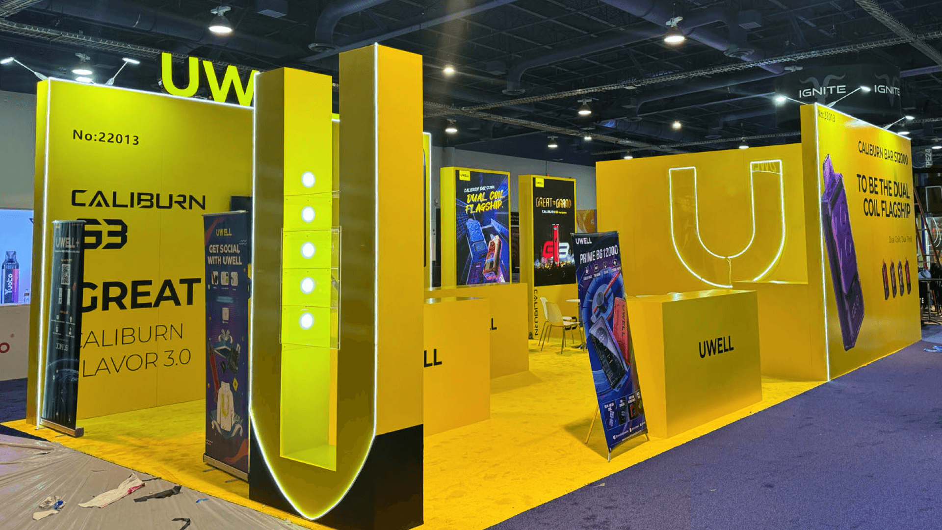 las-vegas custom exhibit build with bold architectural structure, integrated LED lighting, and branded display counters