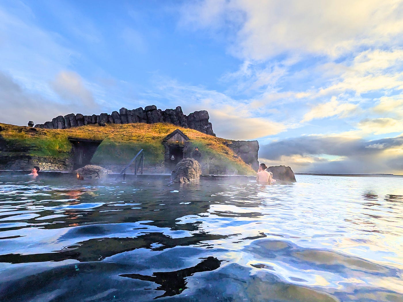 agoon geothermal pool in Flúðir with steam rising from warm water in South Iceland